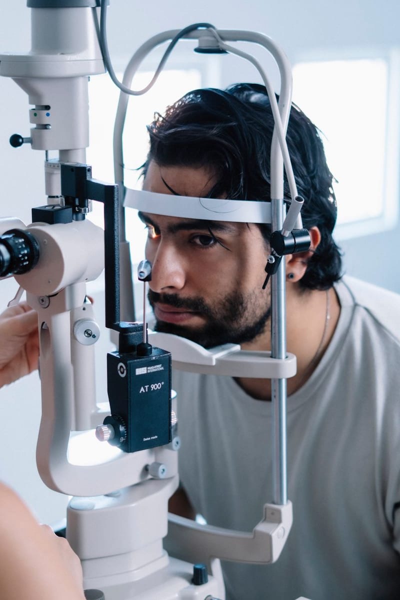 A patient at the slit lamp for an eye pressure test